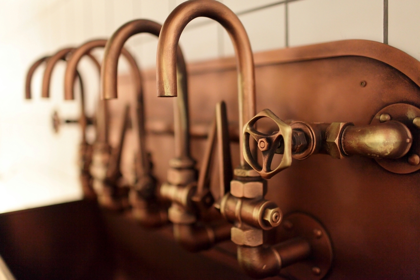 The copper taps on an old brewery
