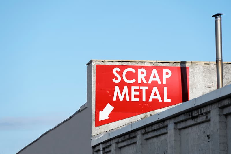 Scrap metal sign with arrow