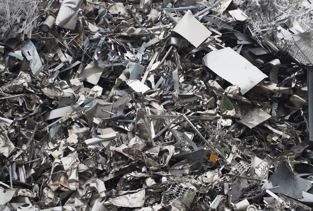 Aluminium and ferrous materials scrap ready for recycling. Full frame, background and texture.